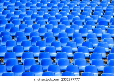 Empty grandstand with empty chairs in the stadium - Powered by Shutterstock