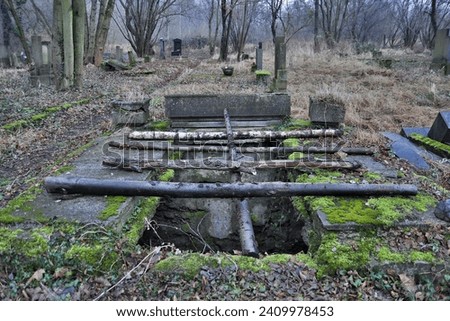 The empty grave in abandoned cemetery 