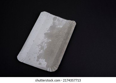 Empty Grease Paper Plate On A Black Background