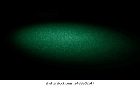 Empty green casino poker table felt texture with small spotlight and black vignette - Powered by Shutterstock