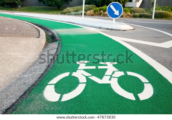 Empty green cycle
track with bike lane sign
