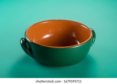 Empty Green earthenware casserole typical of Tuscany with clipping path