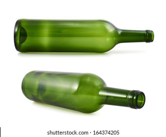 Empty green glass bottle lying on its side, isolated over white background, set of two foreshortenings