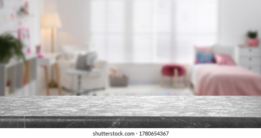 Empty Grey Stone Table In Baby Room Interior