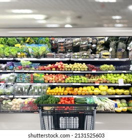 empty grocery cart in an empty supermarket - Powered by Shutterstock