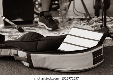 Empty Guitar Case Of An Street Musician