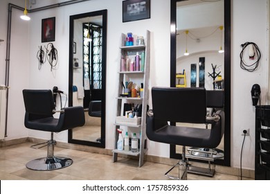 Empty Hair Salon Interior With Chairs And Mirrors.