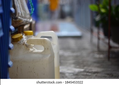 An Empty And Half Full Kerosene Jerry Can. Kerosene Is Still Used For Cooking In Some Parts Of Indonesia