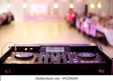 Empty hall during party or wedding celebration by dj mixer and space for text