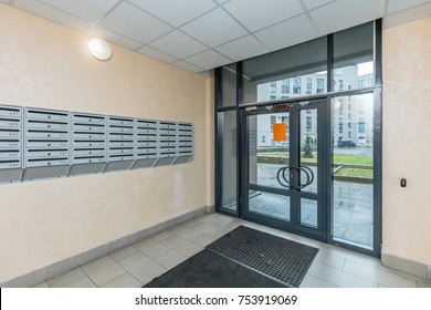 Empty Hall Mailboxes And Doors At New Apartment Building