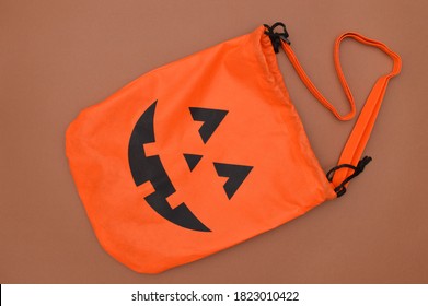 Empty Halloween Pumpkin Trick Or Treat Bag On Brown Background