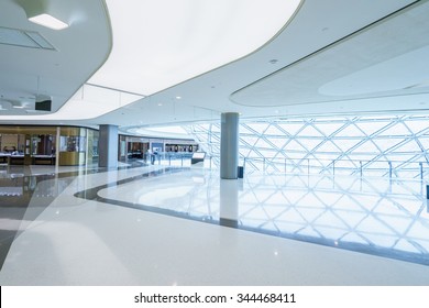 Empty Hallway With A Huge Billboard And Abstract Ceiling In Modern Shopping Mall