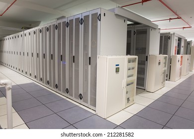 Empty Hallway Of Server Towers In Large Data Center