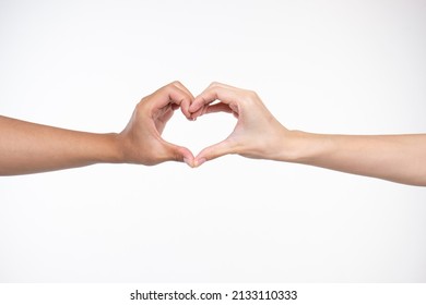 The empty  hand makes a gesture like holding something isolated in hand behind a white background.