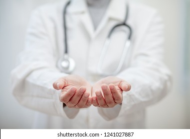 Empty Hands Of The Doctor , Medical Professional Handed Holding Virtual Object To Paste Text Or Item Product . Healthcare And Advertisement Concept, Copy Space