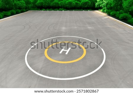 empty helipad surrounded by trees