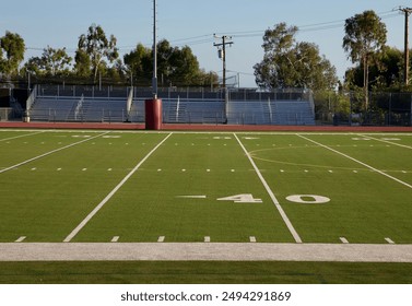 Empty high school football field - Powered by Shutterstock