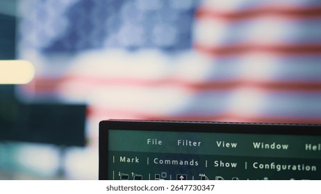 Empty high tech office with a big screen showing an American flag, representing cybersecurity operations. Encryption, malware detection and security protocols to ensure data security. Camera B.