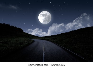 Empty high way at night. Moonlight over the road with moon and stars