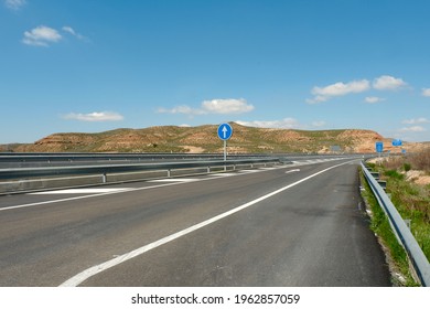 Empty Highway Along Mountain Countryside Landscape During Covid Pandemic In Castilla-La Mancha, Spain