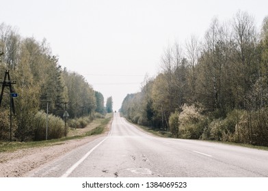 Empty Highway Between Deciduous Trees In Autumn Colors, In The Distance Electronic Toll Gates, View From Above