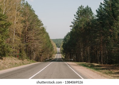 Empty Highway Between Deciduous Trees In Autumn Colors, In The Distance Electronic Toll Gates, View From Above