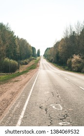 Empty Highway Between Deciduous Trees In Autumn Colors, In The Distance Electronic Toll Gates, View From Above