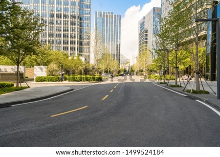 empty highway with cityscape and skyline of qingdao,China.