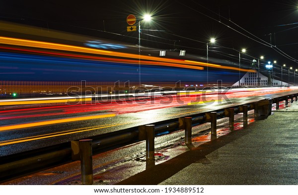 An empty highway in a fog at night. Street\
Lights close-up, motion blur effect, long exposure. Dark urban\
scene, cityscape.