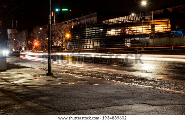 An empty highway in a fog at night. Street
Lights close-up, motion blur effect, long exposure. Dark urban
scene, cityscape.
