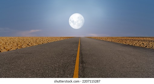 Empty highway outside the city, full moon in the sky in the background. - Powered by Shutterstock