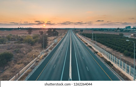 empty highway at sunset from drone