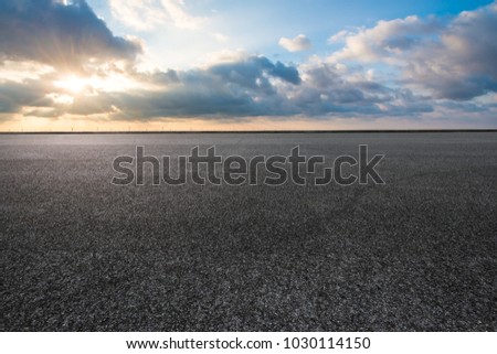 An empty highway under the blue sky