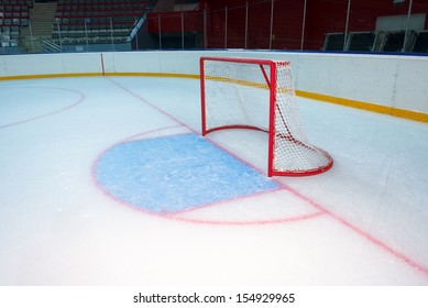 Empty Hockey Goal On Ice Rink. Side View