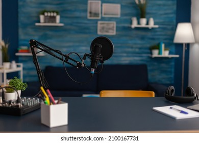 Empty Home Recording Studio With Podcast Equipment. Professional Microphone And Headphones Used For Online Broadcast On Social Media. Electronic Audio Livestream Technology On Desk.