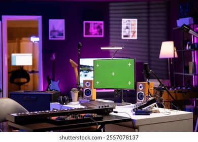 Empty home studio with computer running greenscreen display, audio equipment and mixing instruments used for recording tunes. Music production and acoustics gear in modern space.
