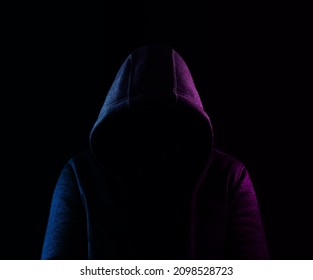 empty Hoodie isolated on black background.  violet and blue light low key image. unrecognizable person. mock up image.  - Powered by Shutterstock