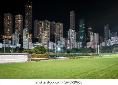 Empty Horse Race Track And Skyline Background  In Hong Kong Jockey Club 