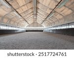 Empty horse riding arena indoor without people