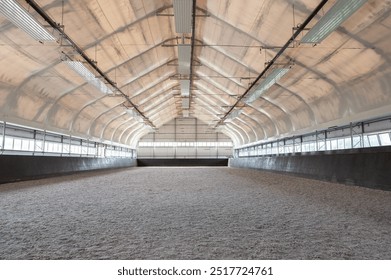 Empty horse riding arena indoor without people - Powered by Shutterstock