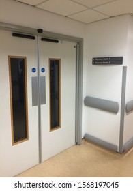 Empty Hospital Corridors With Theatre Signage