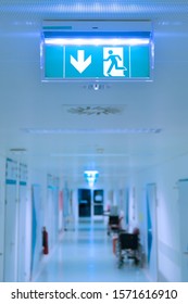 Empty Hospital Hallway. Exit Sign. Medical Healthcare Concept.