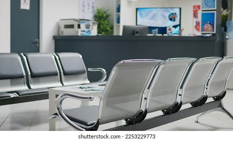 Empty hospital reception desk in waiting area lobby at medical health center, used to help patients with appointments and healthcare insurance. Clinical waiting area with counter. - Powered by Shutterstock