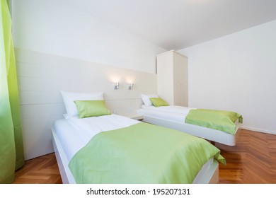 Empty Hotel Or Motel Room With Two Beds