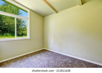 Empty House Interior. Small  Room With Window And Brown Carpet