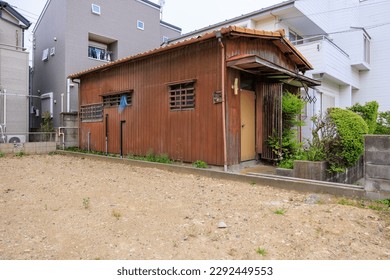 Empty house and vacant lot in residential area