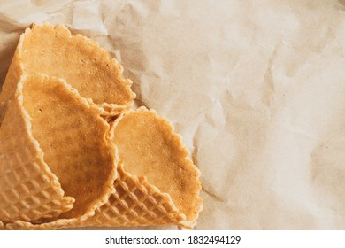 Empty Ice Cream Cone. Empty Waffle Cups On Crumpled Craft Paper.