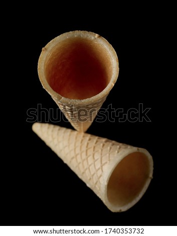 Empty ice cream cones isolated on black background with clipping path