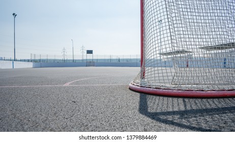 
Empty ice hockey playground - the view from behind the gate. Before the match on top of street hockey. 