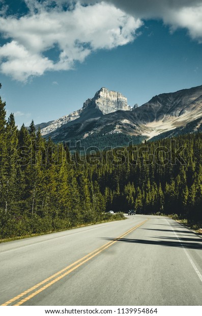 Empty Icefields Parkway Street with Mountain Panorama\
in Banff N